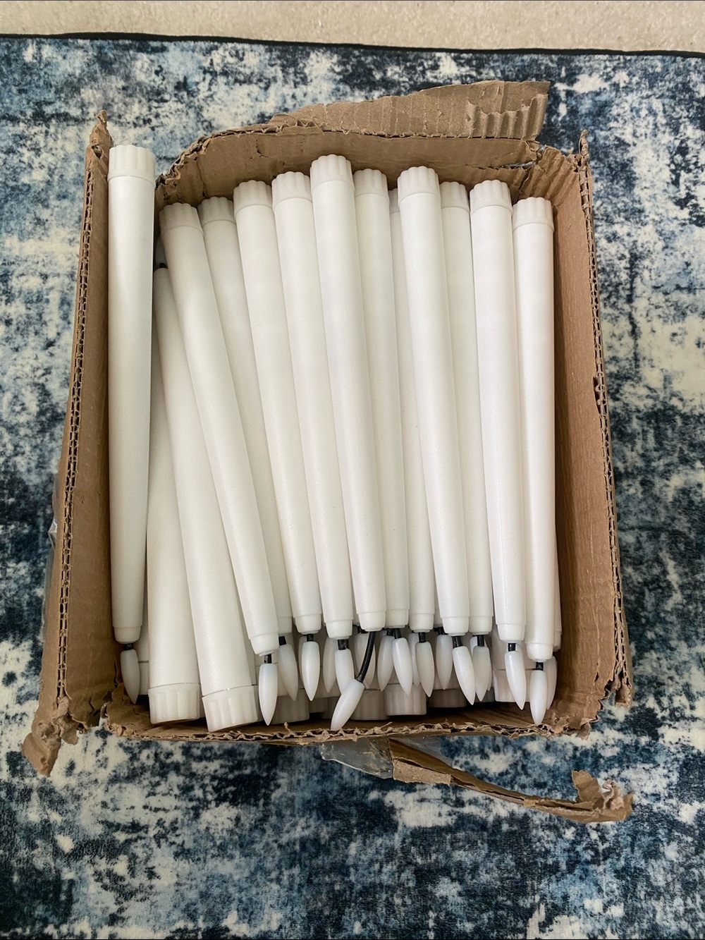 Box of White Plastic Taper Candles - Pack